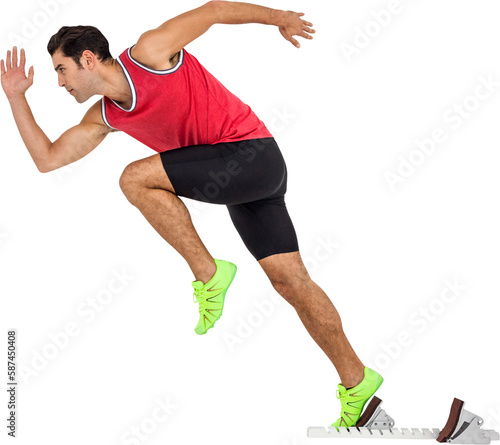 Confident male athlete running from starting blocks