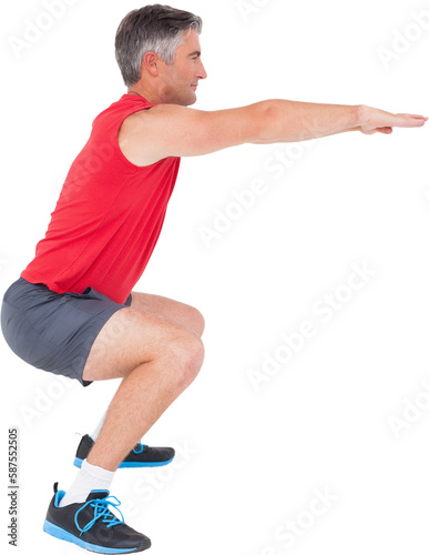 Fit man doing a squat