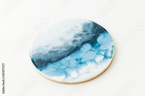 Resin epoxy art with soft blue and white colors. Epoxy effect background