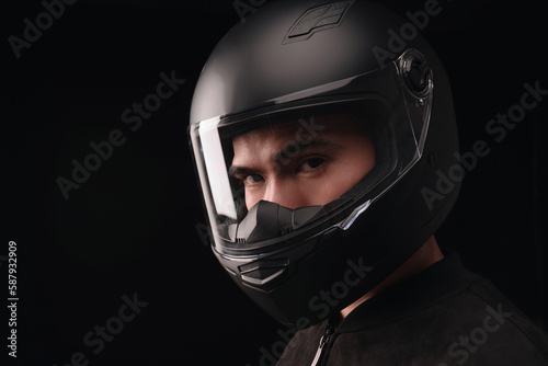 Image of young Asian man with helmet on background