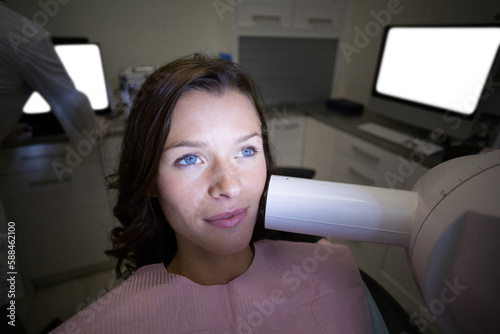 Female patient receiving dental treatment