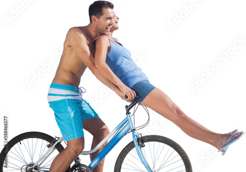 Man cycling while woman sitting