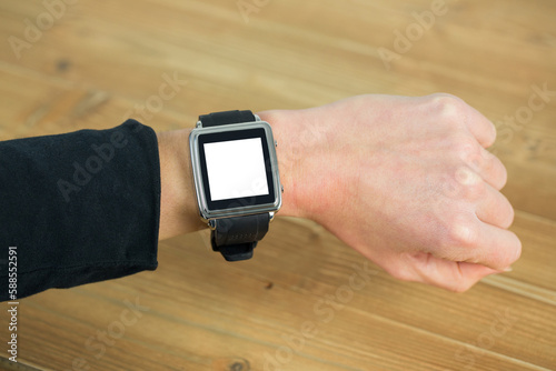 Businesswoman with smart watch on wrist