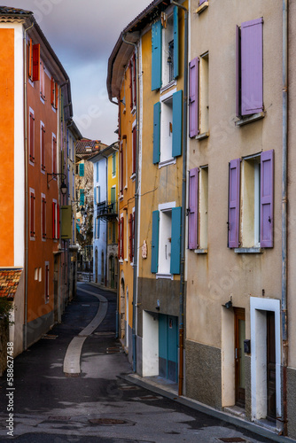 narrow village street in the center of Castellane with colourful houses