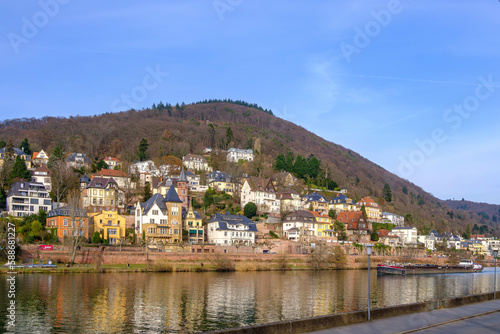 The barge MINERVA, sailing down the Neckar river and transporting scrap metal, passes the Old Town of Heidelberg, Baden-Württemberg, Germany, Europe, February 22, 2023.