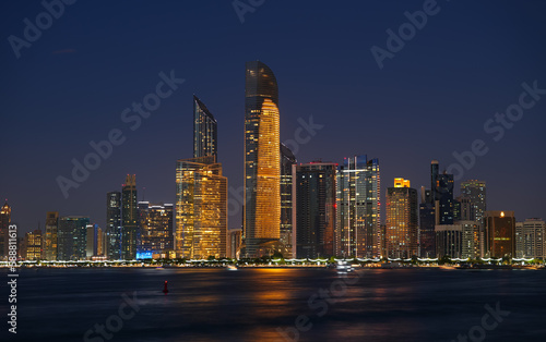 Abu Dhabi by night. Long exposure photo during the blue hour with the amazing skyline of Abu Dhabi. Travel to United Arab Emirates.