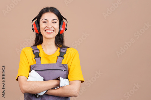 Friendly caucasian woman carpentry worker in work uniform