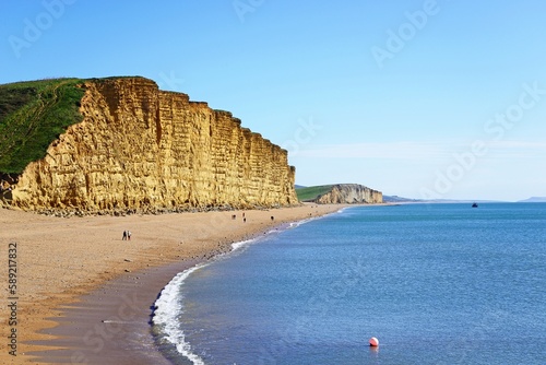 View along the beach and Jurassic Coast coastline, West Bay, Dorset, UK, Europe.