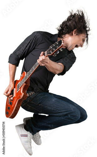 Portrait of a Musician Jumping while Playing an Electric Guitar