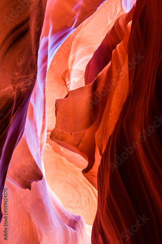 Antelope Canyon in the Navajo Reservation Page Northern Arizona. Famous slot canyon. Multicolored texture, rock formation, game of lights.
