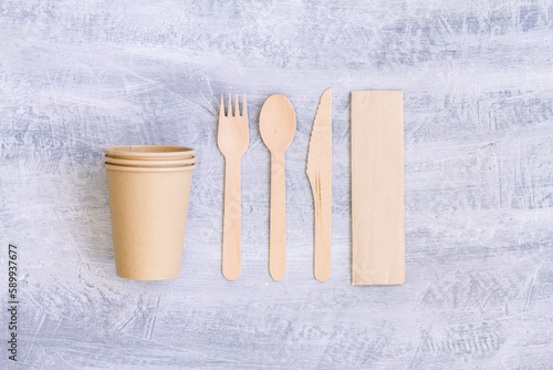 zero waste, plastic free,recyclable, sustainable utensils including fork, spoon, knife, cups and a napkin with copy space. Top view, overhead view ,above view or a flat lay composition