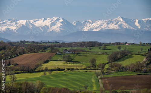 Beautiful spring landscape in the Gers department in the southwest of France , with snowy Pyrenees mountains