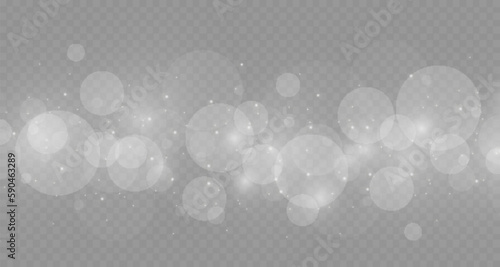 Dust sparks and stars shine with a special light. Christmas light effect. Glittering particles of magic dust.Vector sparkles on a transparent background.