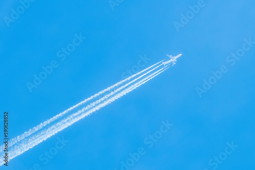Jet in the blue sky. Diagonal view. Aircraft travel.