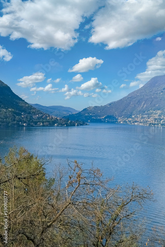 Como city in Italy, view of the city from the lake, with mountains in background 