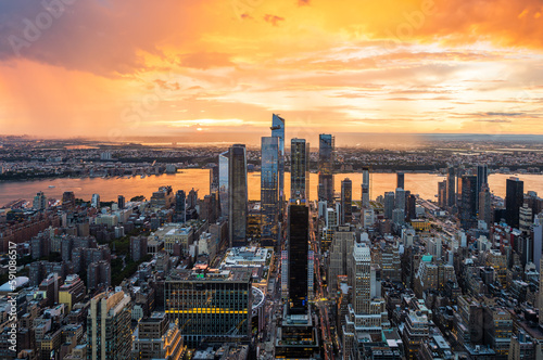 A beautiful colourful sunset during rainy storm over the Hudson Yards in New York City.