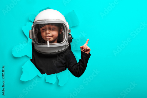 small child imagines himself to be an astronaut