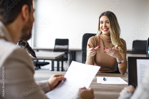 Happy female candidate on a job interview in the office.