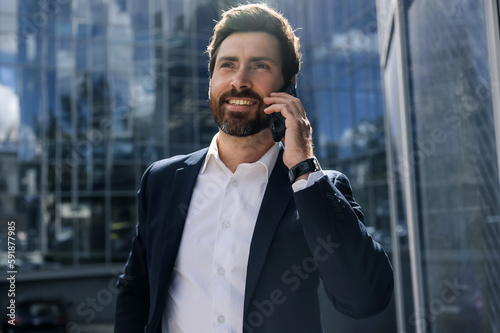 Stylish businessman having a phone call