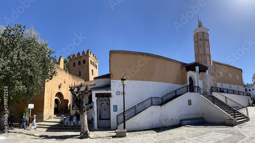 Morocco, Africa: view of Outa el Hamam, the central square of Chefchaouen dominated by the 15th century kasbah and the town Grand Mosque