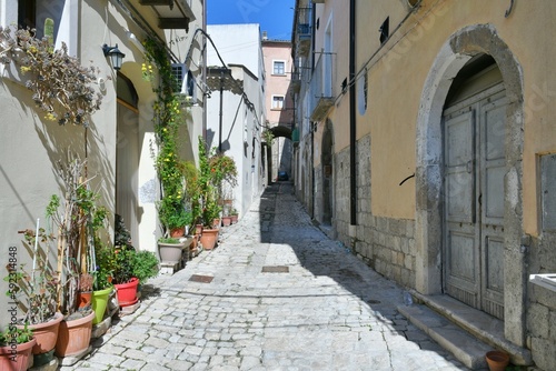 A narrow street among the old houses of Larino, a medieval town in the province of Campobasso in Italy.