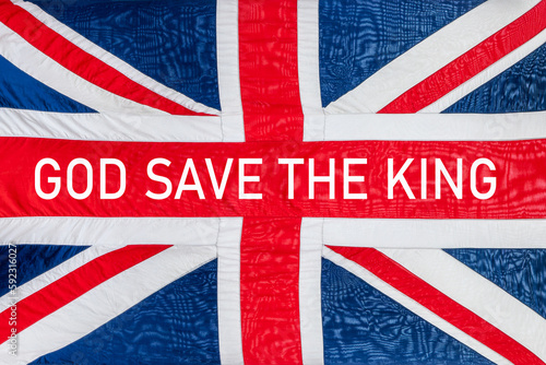 God saves the king written a british UK flag, Union Jack background, king coronation or funeral celebration