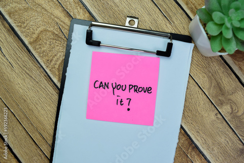 Concept of Can You Prove it? write on sticky notes isolated on Wooden Table.