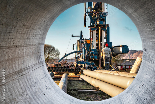 The drilling rig close-up is drilling a well against the background of the cloudy sky. Deep hole drilling. Geological exploration work. mineral exploration. Extraction of gas and oil.