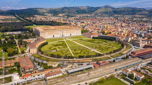 Aerial view of the Royal Palace of Caserta also known as Reggia di Caserta. It is a former royal residence with large gardens in Caserta, near Naples, Italy. The historic center of the city is nearby.