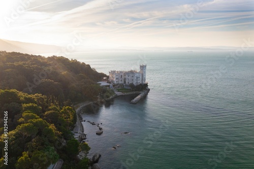 Aerial of the Miramare Castle in the scenic Gulf of Trieste in Italy captured on a bright day