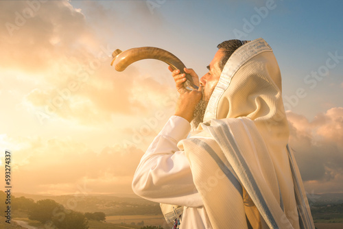 A Jewish man blowing the Shofar (ram's horn), which is used to blow sounds on Rosh HaShana (the Jewish New Year) and Yom Kippur (day of Atonement)