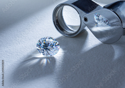 The process of appraisal of diamonds at the workplace of buyer during the action. High quality photo