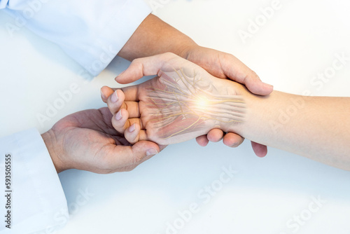 The orthopedic doctor or surgeon in uniform examined the patient with numbness of hand.Wrist pain in carpal tunnel syndrome with transparent anatomy of median nerve.Light effect on white background.