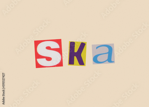 Ska word from cut out magazine colored letters on a light background