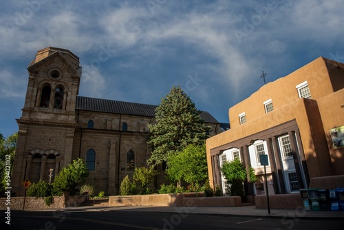 Low angle shot of Santa Fe plaza and a church against a blue sky in New Mexico