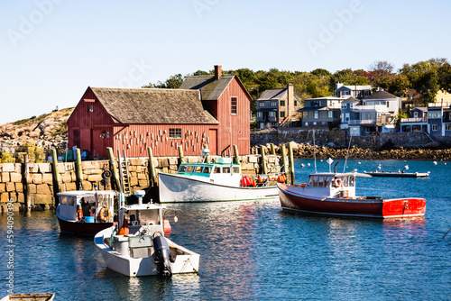 Afternoon sun illuminating Motif Number 1 and lobster boats, Bradley Wharf, Rockport, MA. 