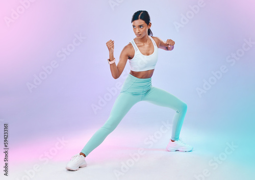 Fitness, woman and fighting pose in studio for karate, martial arts or defence training on gradient background. Power, sports and indian female in intense workout, exercise and posing while isolated
