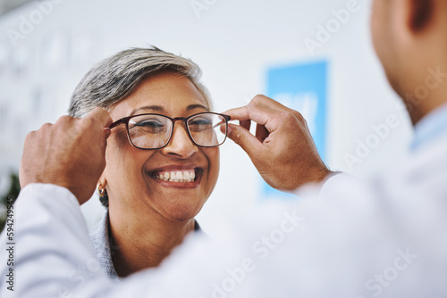 Optometry, smile and woman with prescription glasses, optician and helping client with product. Female person, employee and optometrist assist with eyewear, clear vision and buying new spectacles