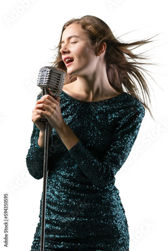 Beautiful young female singer with vintage microphone