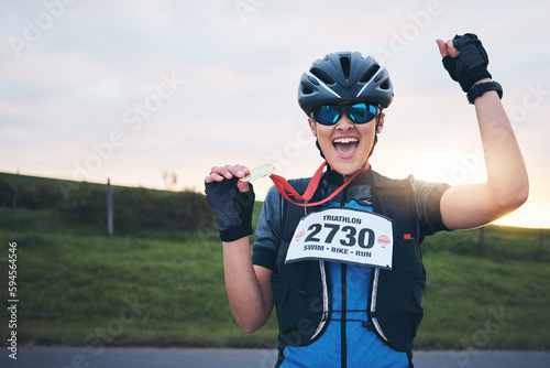 Celebrate, sport and portrait of happy woman with medal for winning outdoor cycling race or triathlon. Happiness, win and cyclist with smile, fitness and excited celebration for gold winner at sunset