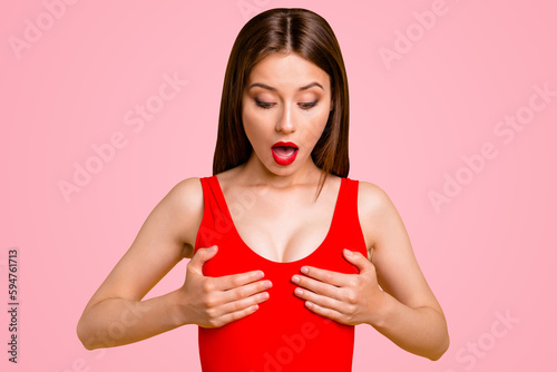 Magic pills for enlargement tits helped me Wow omg I drop smth between tits Close up photo portrait of impressed crazy beautiful nice funny funky lady touching breast isolated on vivid background
