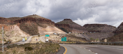 Landscape on I40 Eastbound just outside Kingman, Arizona shows the exposed volcanic ash deposits from the road cut