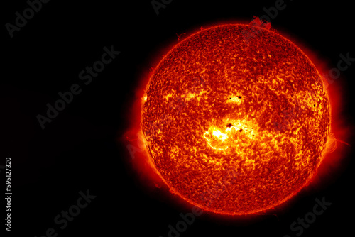 The sun from outer space on a dark background. Elements of this image furnished NASA.