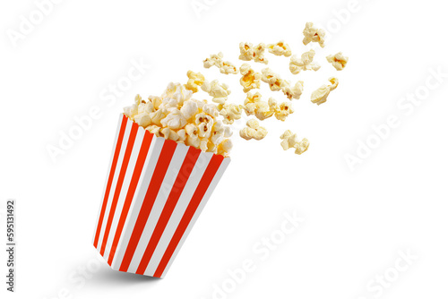 Popcorn flying out of red white striped paper box isolated on white, transparent background, PNG, with copy space. Splash, levitation of popcorn grains.