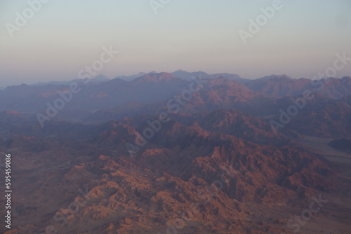 Aerial view from window plane of mountains in Egypt.
