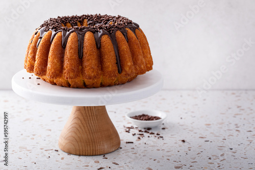 Orange pound cake with dark chocolate ganache and sprinkles