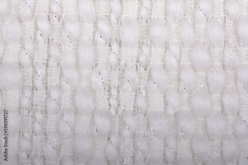 Artic white delicate plush acrylic wool woven fabric texture closeup for seamless background. Comfortable style cloth, selective soft focus for warmth and cozy feels. Seamless