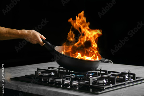 Flambering food ingredients in a frying pan