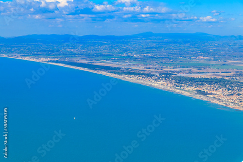 View from a flying plane on Fiumicino bay and the Tyrrhenian sea, Italy