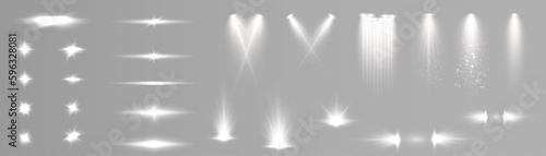 Set of white light spotlights, flashes of light on a transparent background. Vector glowing light effect.